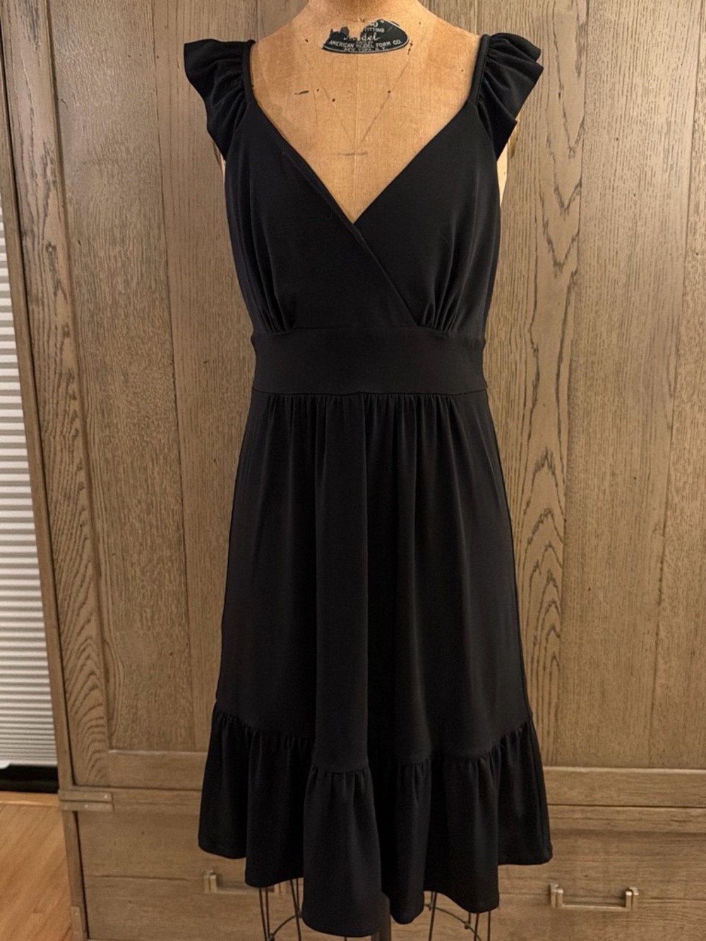 White House Black Market LBD in size 4 Elegant Black V-Neck Ruffle Hem Dress